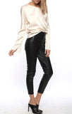 Line and dot faux leather leggings